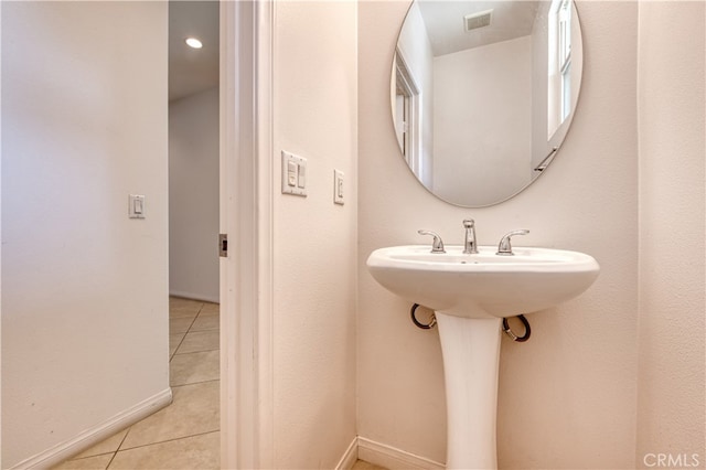 bathroom featuring tile patterned flooring