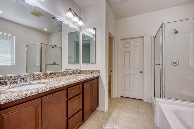 full bathroom with plus walk in shower, tile patterned flooring, vanity, and toilet