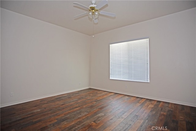 unfurnished room featuring ceiling fan and dark hardwood / wood-style flooring