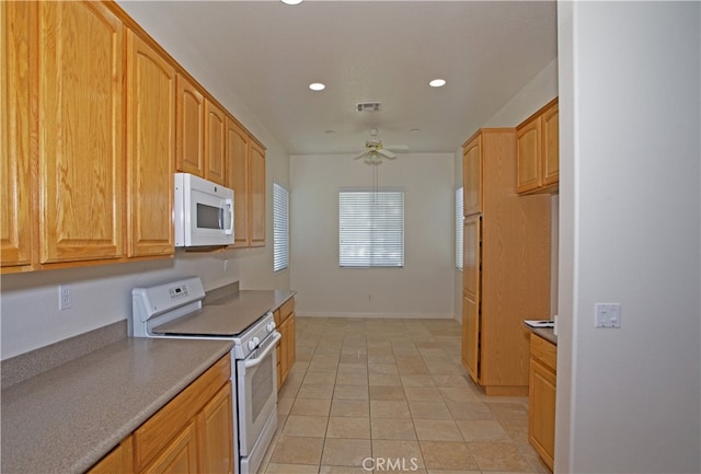 kitchen with ceiling fan, light tile patterned floors, and white appliances