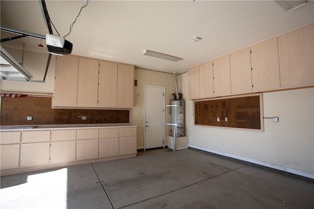 garage featuring gas water heater and a garage door opener