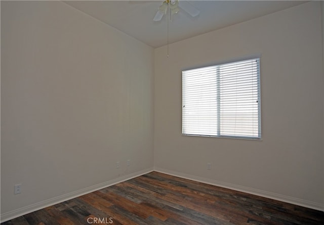 unfurnished room featuring dark wood-type flooring and ceiling fan