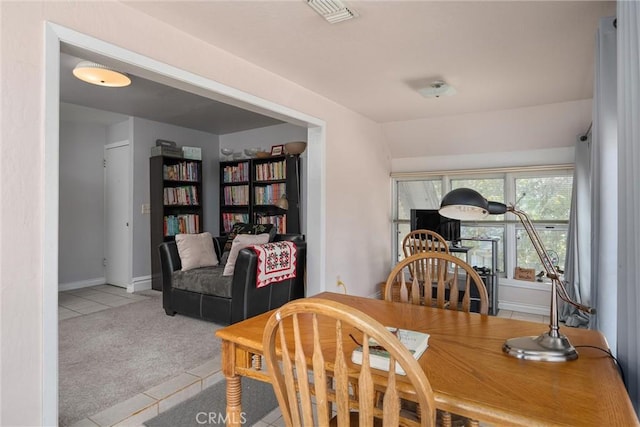 view of carpeted dining space