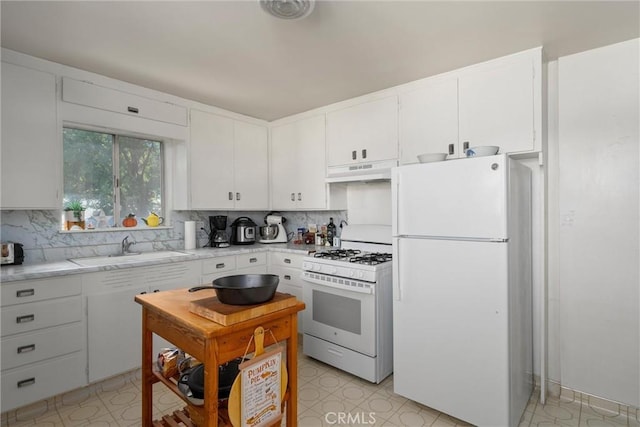 kitchen featuring white cabinetry, sink, white appliances, and backsplash