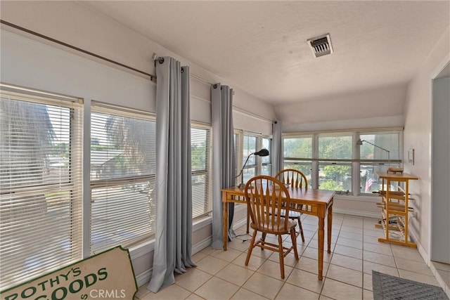 sunroom / solarium featuring lofted ceiling