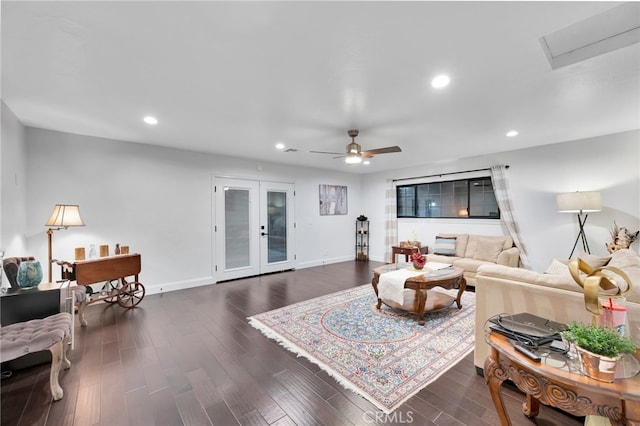 living room with ceiling fan and dark wood-type flooring