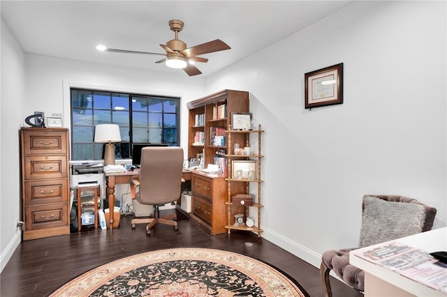 office with ceiling fan and dark hardwood / wood-style flooring