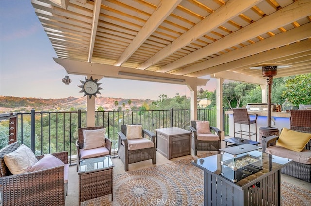 view of patio / terrace featuring a balcony and an outdoor living space