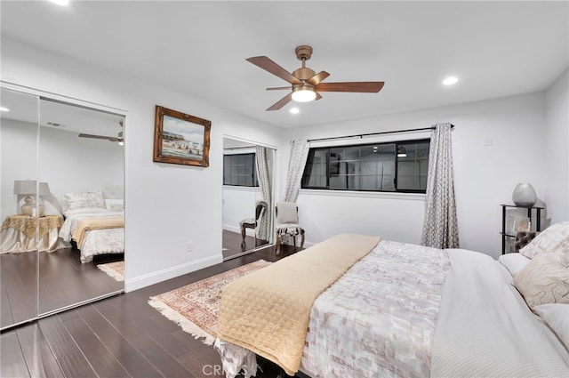 bedroom featuring dark hardwood / wood-style floors, ceiling fan, and a closet