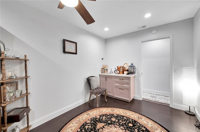 interior space featuring ceiling fan and dark hardwood / wood-style floors