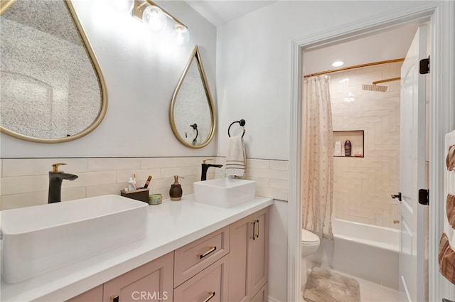 full bathroom featuring vanity, tile walls, toilet, and shower / tub combo with curtain