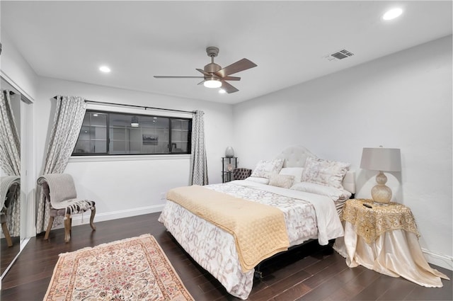 bedroom with ceiling fan and dark hardwood / wood-style flooring