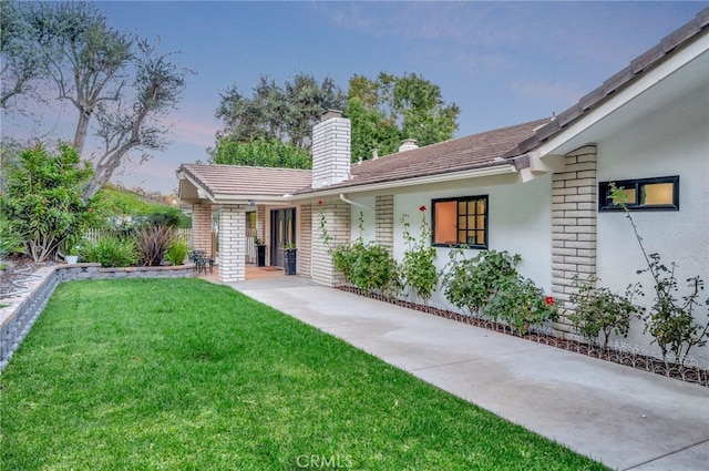 view of front of property with a yard