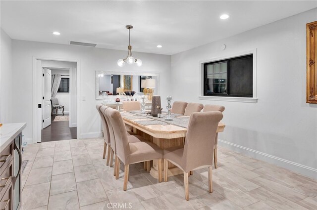 dining room featuring an inviting chandelier