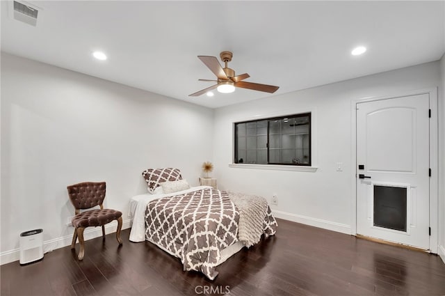 bedroom with ceiling fan and dark hardwood / wood-style floors