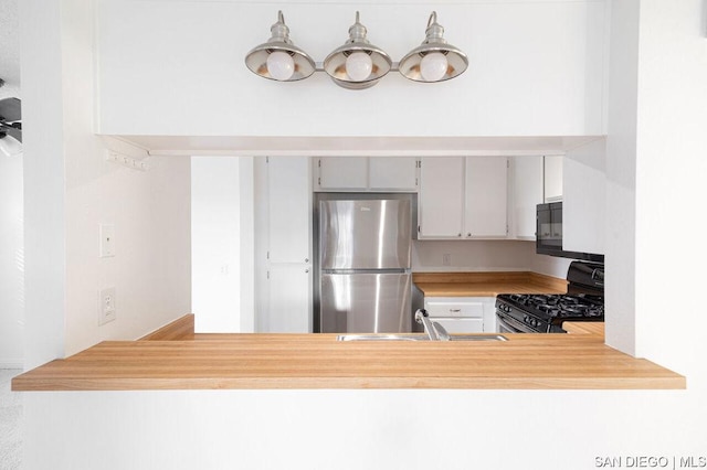 kitchen featuring sink and black appliances