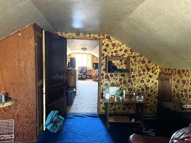 bonus room featuring carpet floors and lofted ceiling