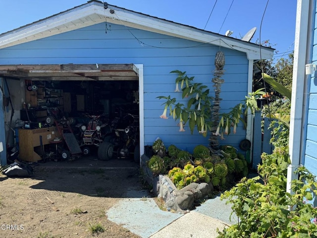 garage featuring wood walls