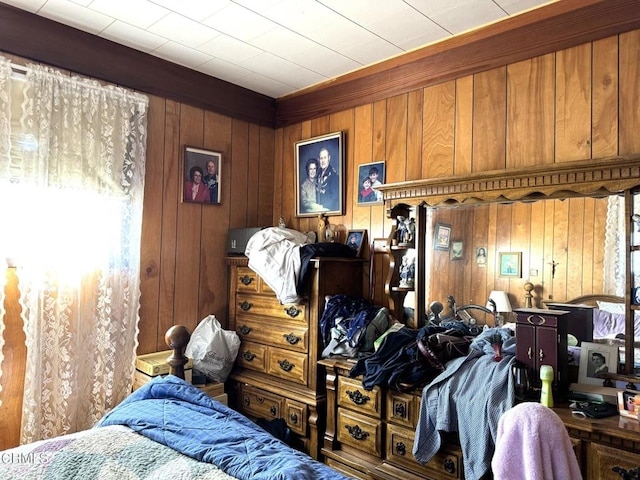 bedroom with wood walls