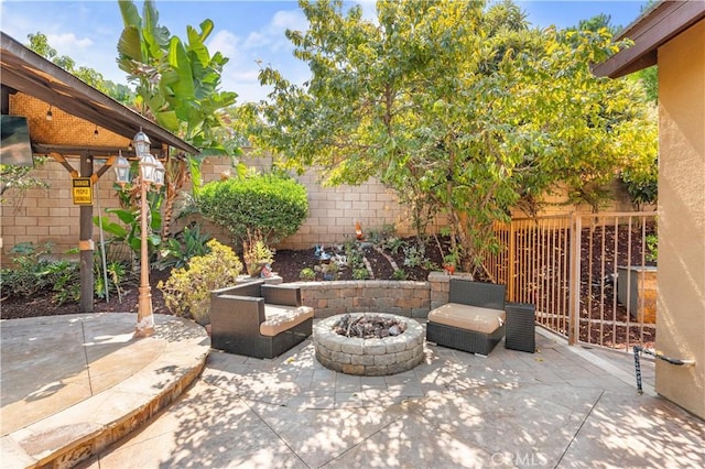 view of patio / terrace featuring an outdoor fire pit