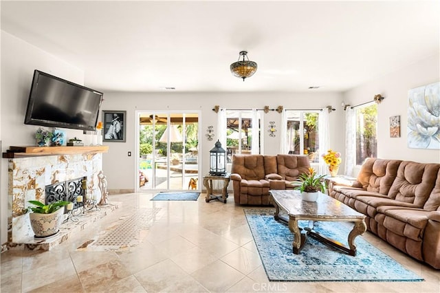 tiled living room with a fireplace