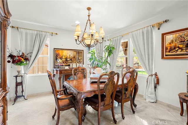 dining room with light tile patterned floors and a chandelier