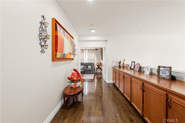 hallway with dark hardwood / wood-style floors