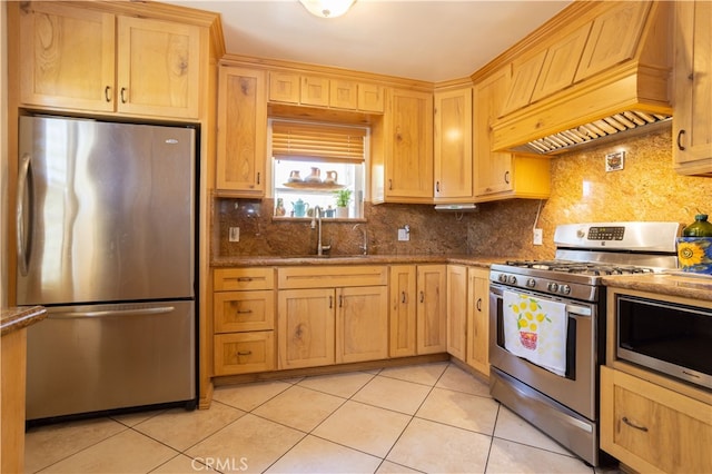 kitchen with custom exhaust hood, light tile patterned flooring, sink, backsplash, and stainless steel appliances