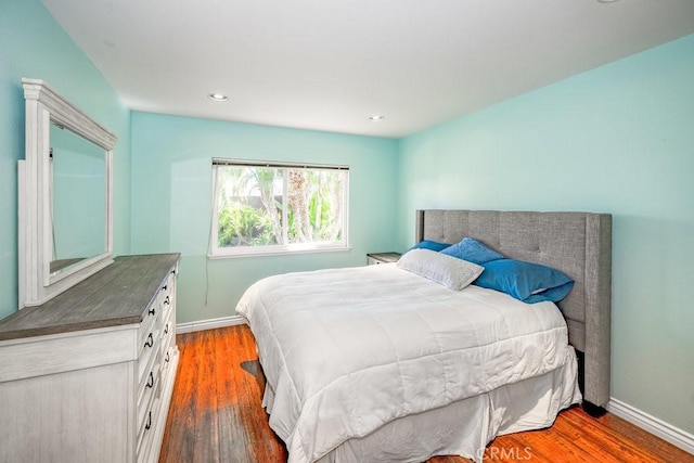 bedroom featuring dark wood-type flooring