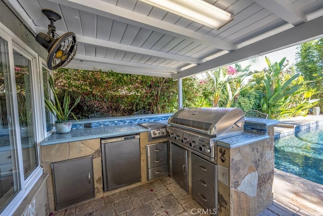 view of patio / terrace with an outdoor kitchen and a grill