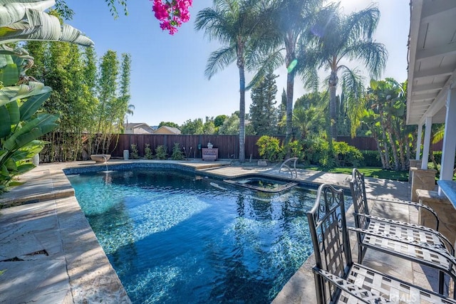 view of swimming pool with a patio area