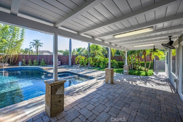 view of pool with an in ground hot tub and a patio