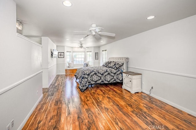 bedroom with ceiling fan and hardwood / wood-style flooring