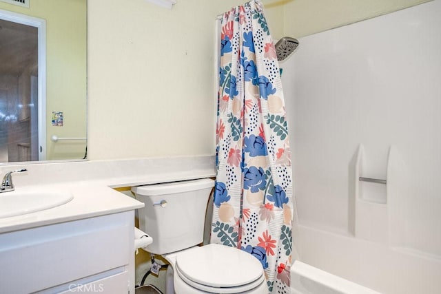 full bathroom with shower / bath combo, vanity, and toilet