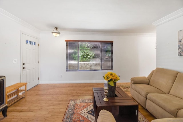 living room featuring light hardwood / wood-style flooring and crown molding