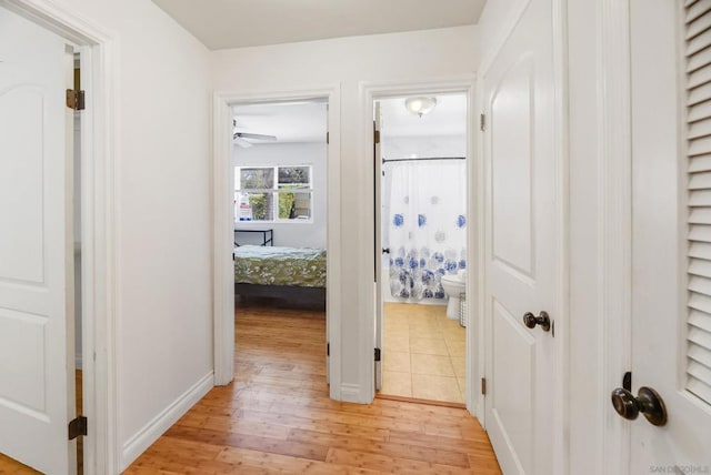 hall with light wood-type flooring