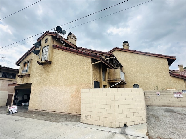 view of property exterior featuring a garage