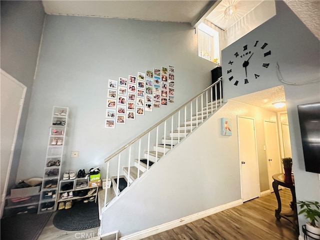 stairway with hardwood / wood-style flooring