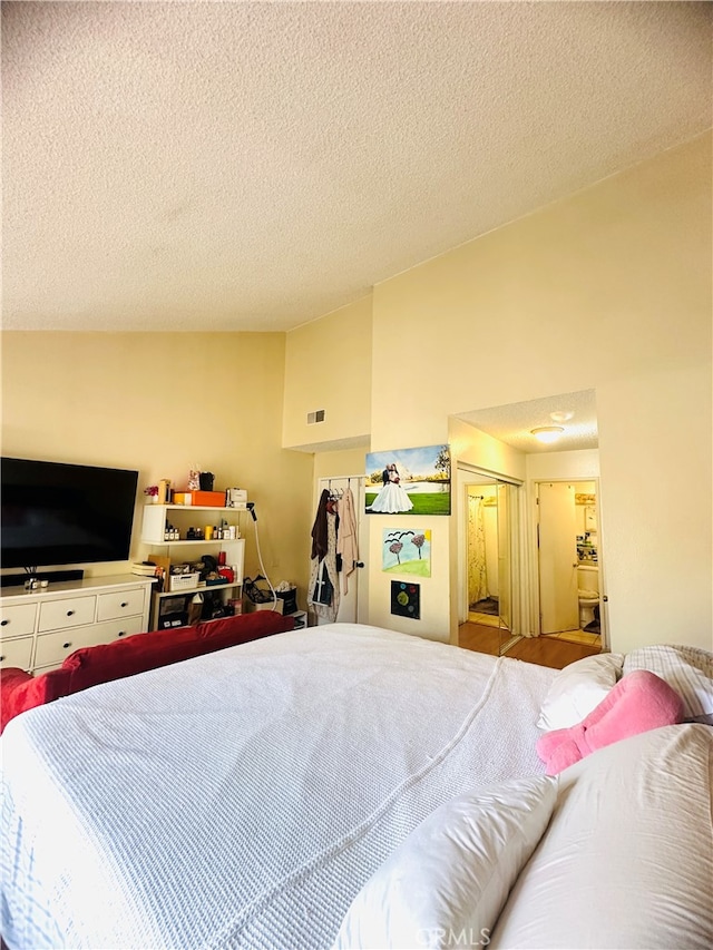 bedroom with a closet and a textured ceiling