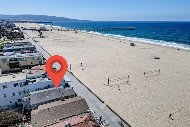 bird's eye view featuring a view of the beach and a water view