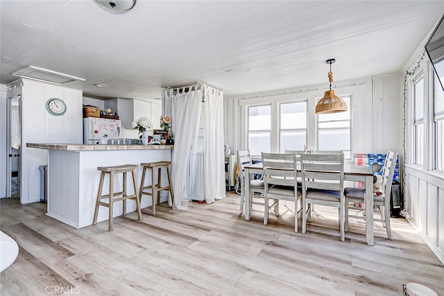 dining area with light wood-type flooring