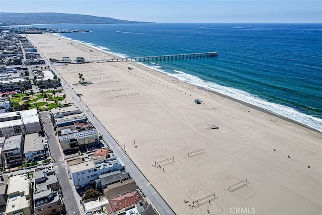 aerial view with a water view and a beach view