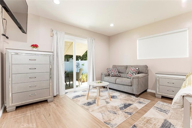 living area with light hardwood / wood-style floors