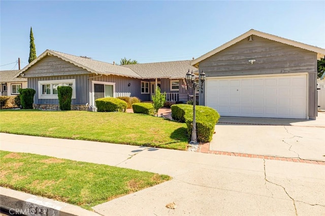 ranch-style home featuring a front yard and a garage