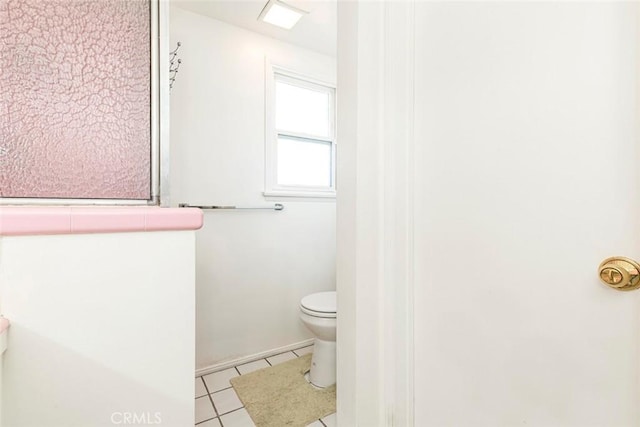 bathroom featuring tile patterned floors and toilet