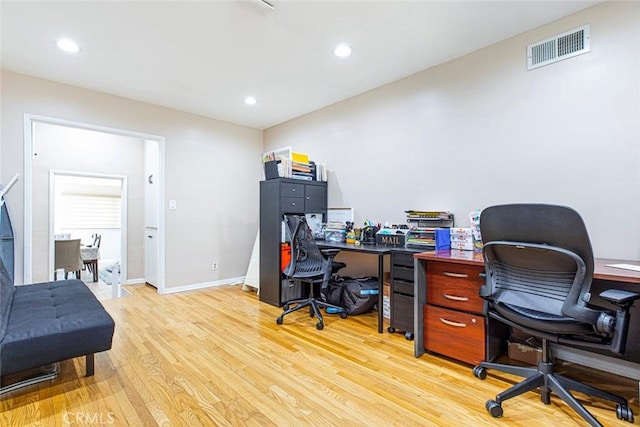 office space with light hardwood / wood-style flooring