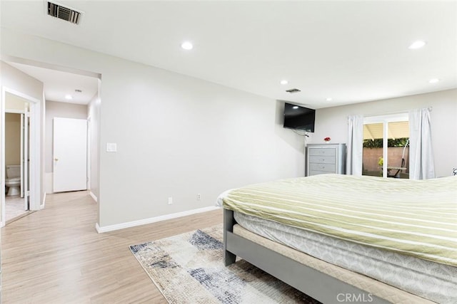 bedroom with light hardwood / wood-style floors