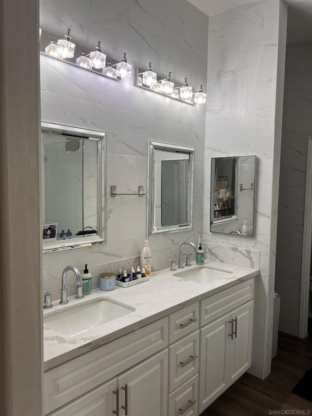 bathroom with hardwood / wood-style flooring and vanity