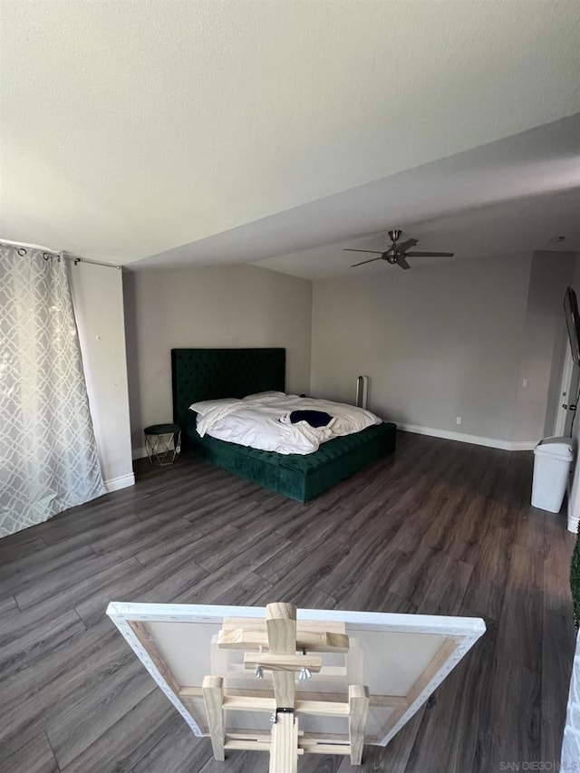 bedroom featuring ceiling fan and dark hardwood / wood-style flooring