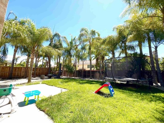 view of yard featuring a trampoline